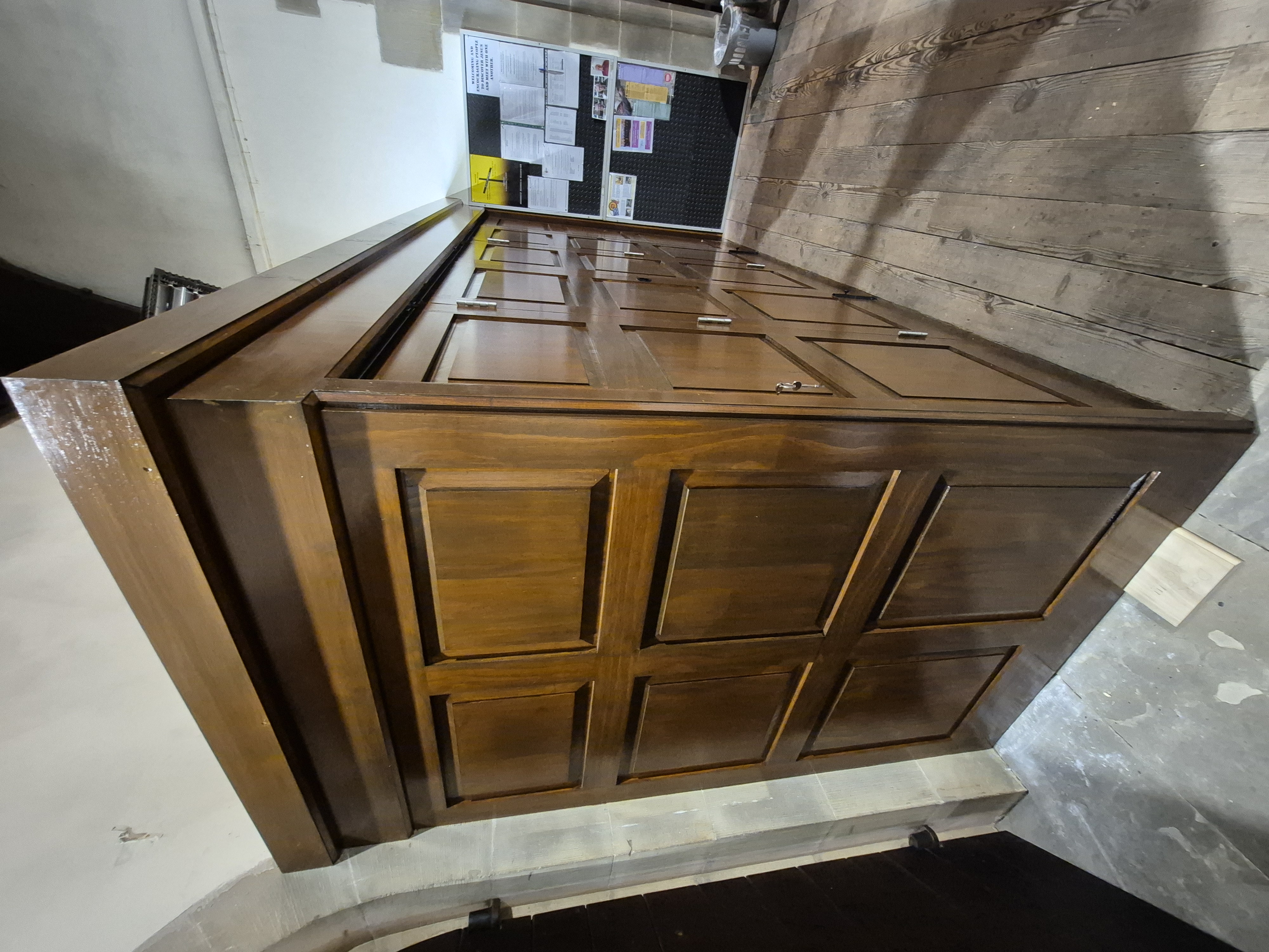 Dark timber cabinetry in a church setting