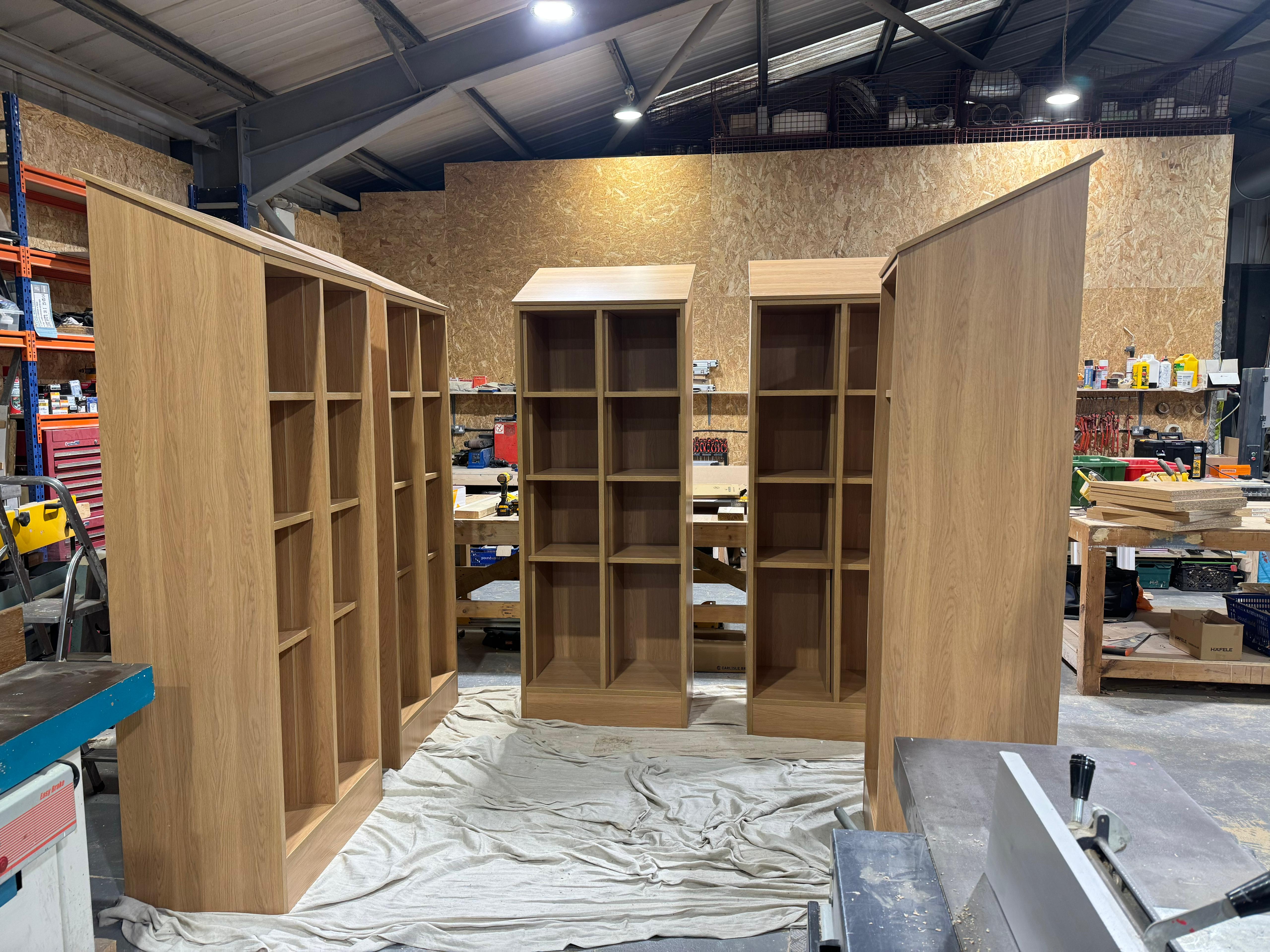 Five oak shelving units in the Northshire workshop