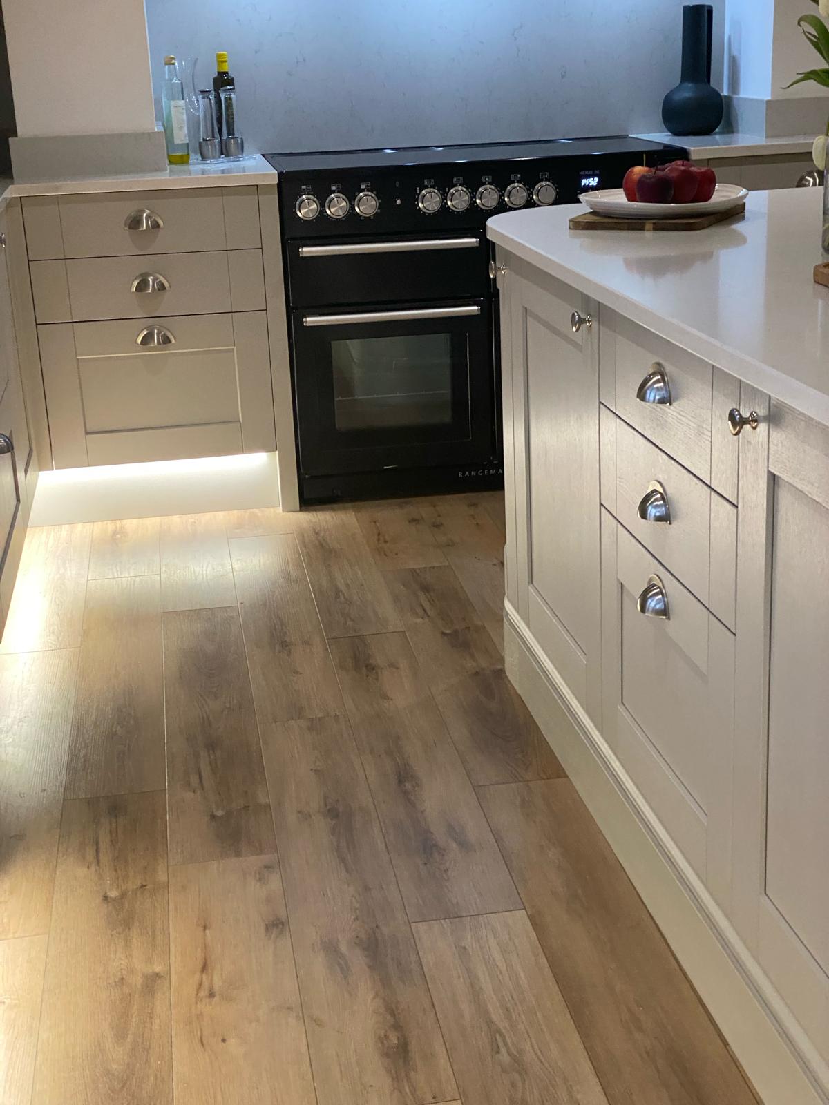 Neutral handmade kitchen with range cooker and island