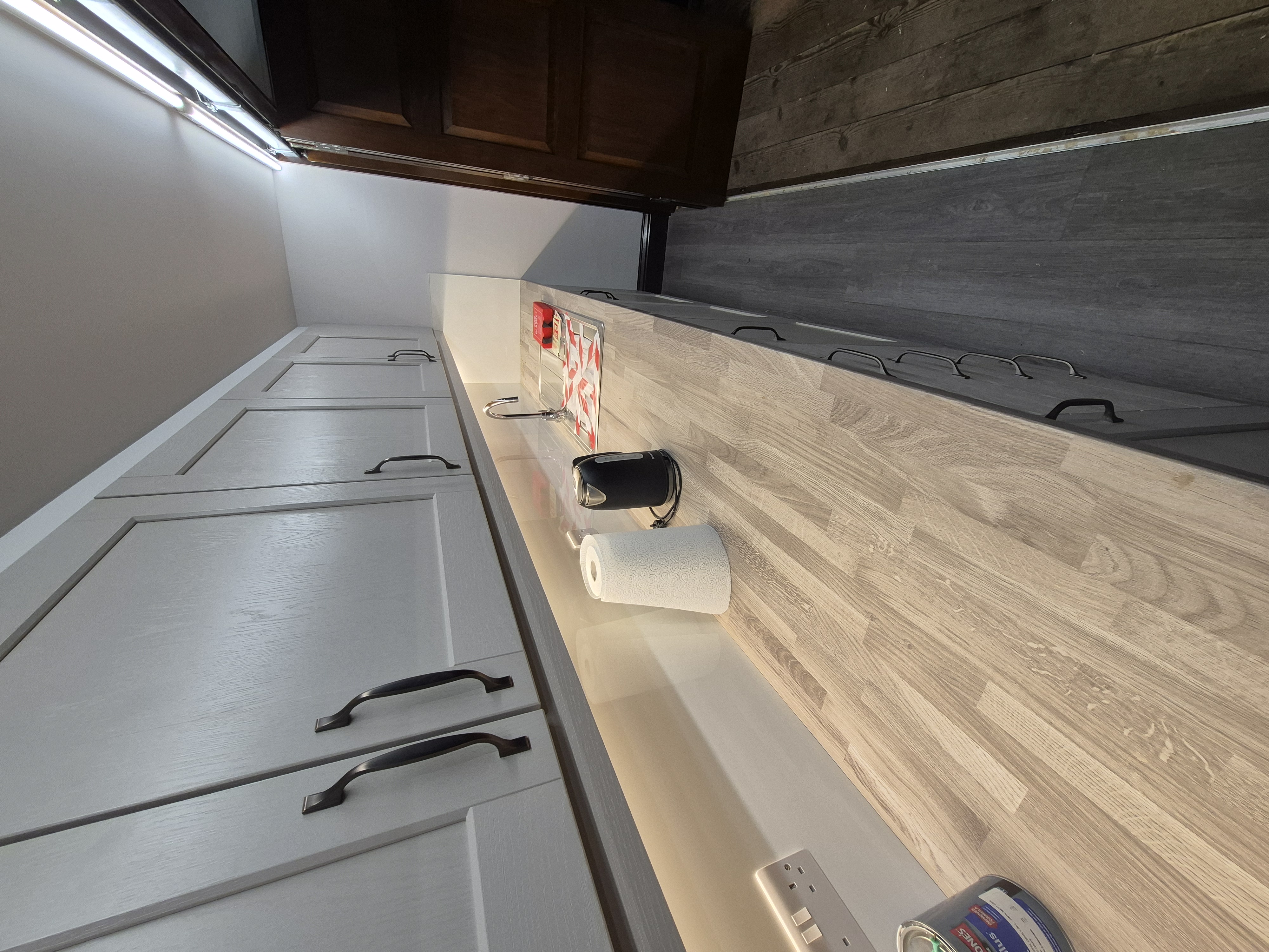 Kitchen cabinetry detail with pale worktop